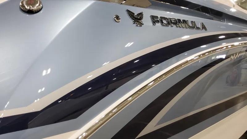 Slide: The Image of 2025 Formula 330 Crossover Bowrider OB, sleek design with elegant blue and silver accents. - 3