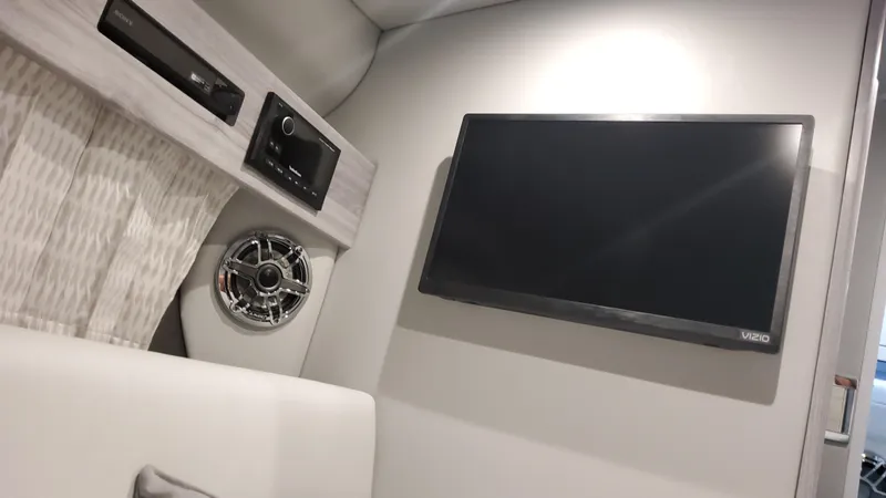 Slide: The Image of Interior of 2025 Formula 330 Crossover Bowrider OB with TV and speaker system. - 31