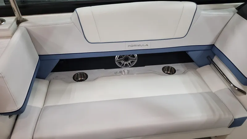 Slide: The Image of 2025 Formula 330 Crossover Bowrider OB interior seating with white and blue upholstery. - 39