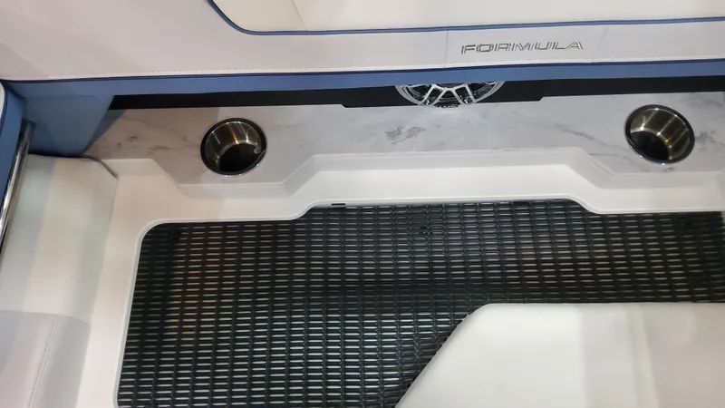 Slide: The Image of 2025 Formula 330 Crossover Bowrider OB interior with cup holders and textured flooring. - 42