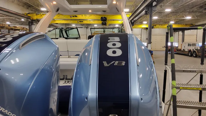 Slide: The Image of 2025 Formula 330 Crossover Bowrider OB with twin 300 V8 engines in a workshop. - 6