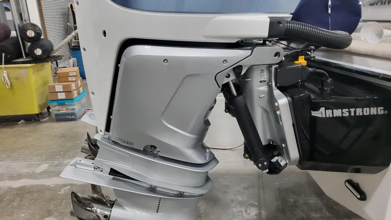 Slide: The Image of 2025 Formula 330 Crossover Bowrider OB outboard motor in a workshop setting. - 9