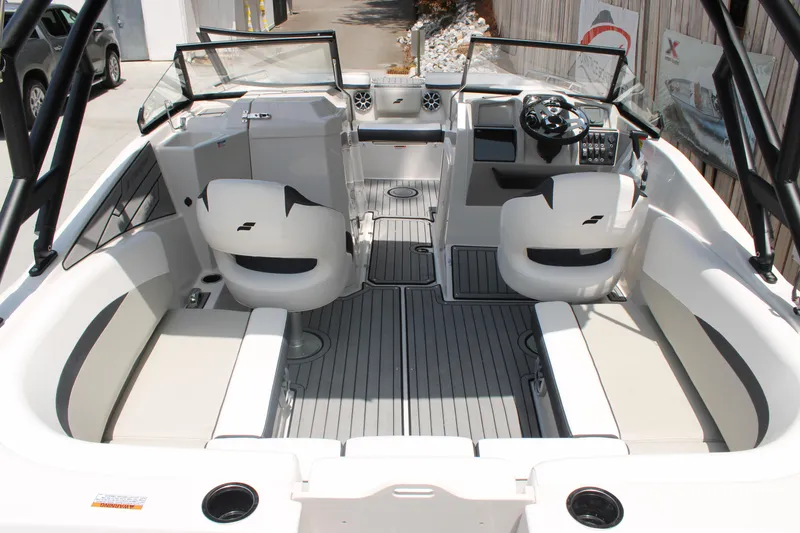 Slide: The Image of 2025 Starcraft 230 boat interior with seating, steering wheel, and modern design. - 7