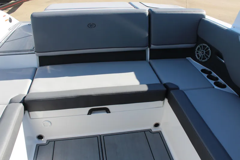 Slide: The Image of 2025 Cobalt CS23 boat interior with gray seating and cup holders. - 16