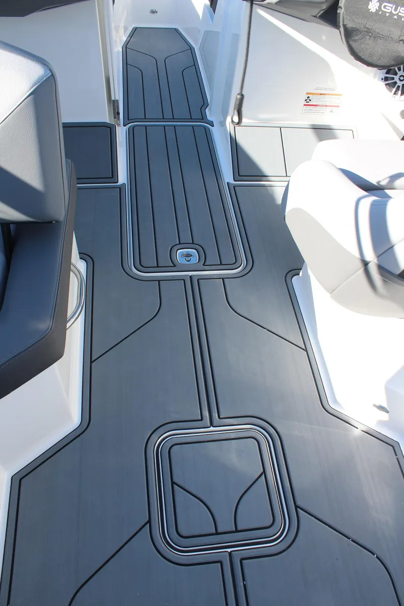 Slide: The Image of 2025 Cobalt CS23 boat interior with sleek, modern flooring design. - 19