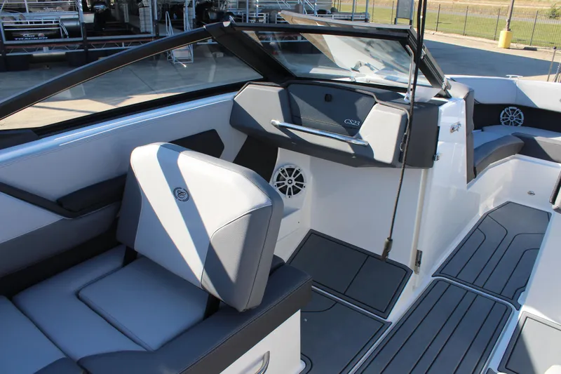 Slide: The Image of 2025 Cobalt CS23 boat interior with modern seating and sleek dashboard design. - 20