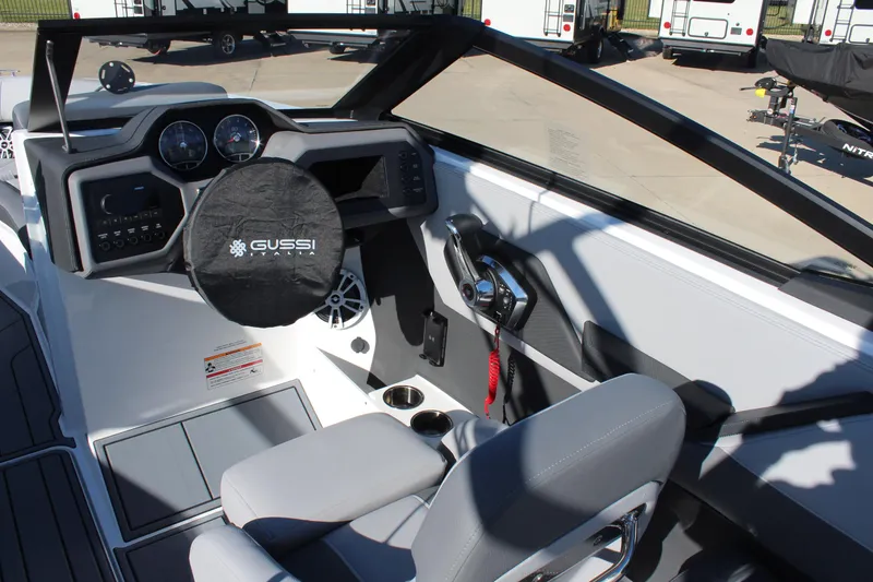 Slide: The Image of 2025 Cobalt CS23 boat interior with modern dashboard and steering wheel. - 21
