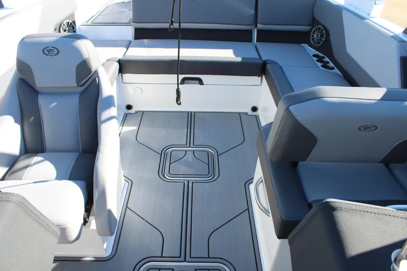Slide: The Image of 2025 Cobalt CS23 boat interior with gray seating and modern design. - 25