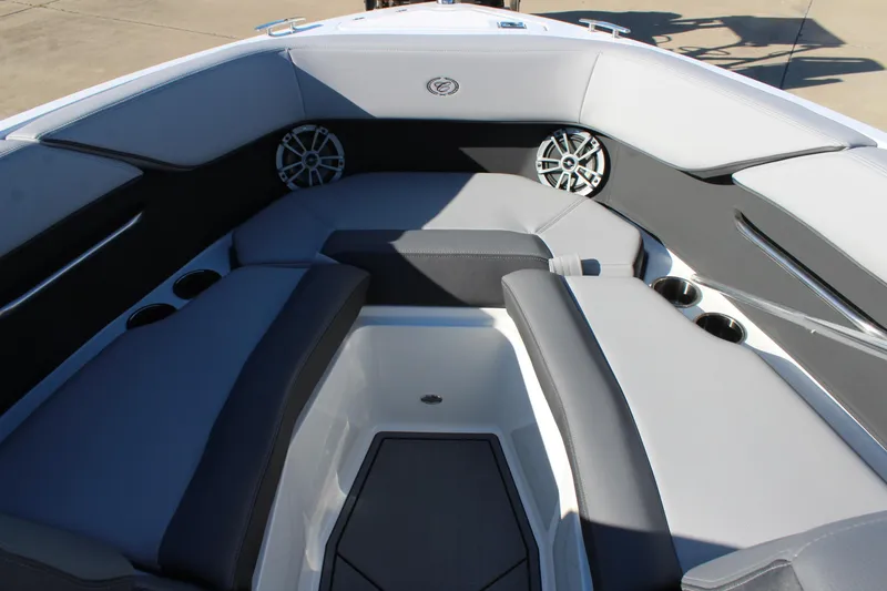 Slide: The Image of 2025 Cobalt CS23 boat interior with gray seating and built-in speakers. - 26