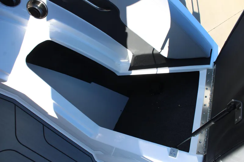 Slide: The Image of 2025 Cobalt CS23 boat interior with sleek black and white design. - 29