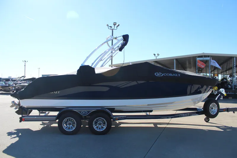 Slide: The Image of 2025 Cobalt CS23 boat on trailer, covered, parked outdoors. - 5