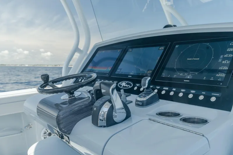 Slide: The Image of Valhalla Boatworks V-41 2023 helm with advanced navigation displays and controls. - 10