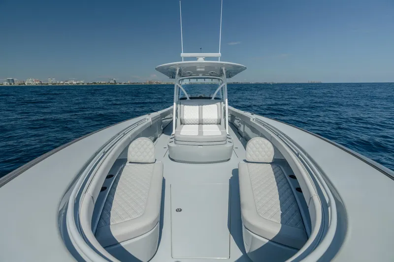 Slide: The Image of 2023 Valhalla Boatworks V-41 on open water, showcasing sleek design and luxury seating. - 13