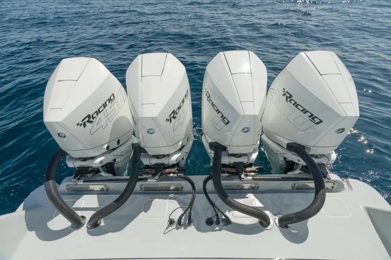 Slide: The Image of 2023 Valhalla V-41 boat with four powerful outboard engines on open water. - 16