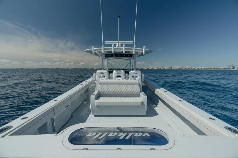Slide: The Image of 2023 Valhalla Boatworks V-41 on open water, showcasing sleek design and spacious deck. - 17