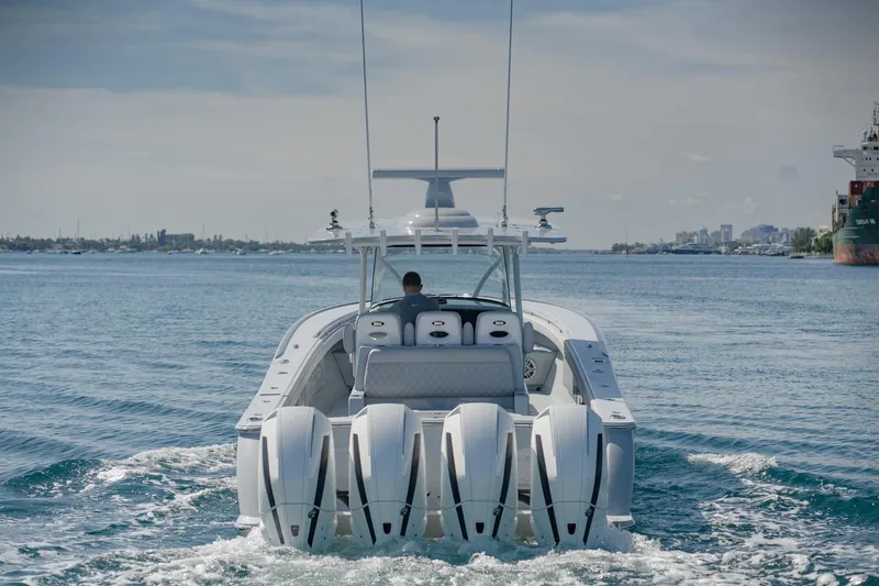 Slide: The Image of 2023 Valhalla Boatworks V-41 cruising on open water with four powerful engines. - 2