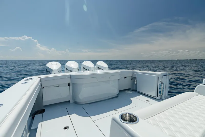 Slide: The Image of 2023 Valhalla Boatworks V-41 on open sea, showcasing spacious deck and engines. - 24