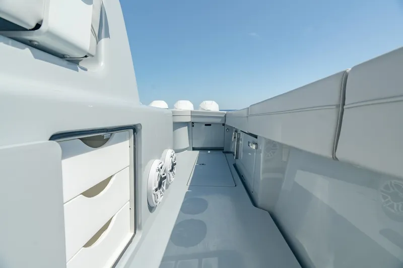 Slide: The Image of 2023 Valhalla Boatworks V-41 interior, sleek design with storage compartments and speakers. - 27