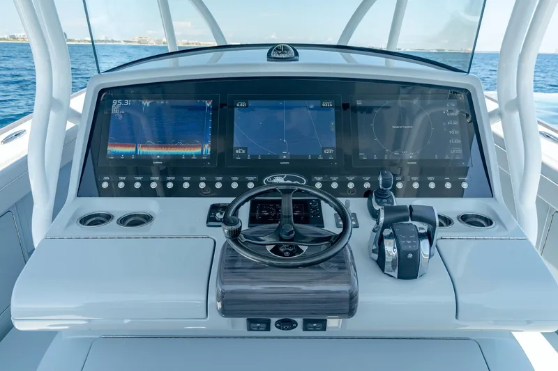 Slide: The Image of 2023 Valhalla Boatworks V-41 helm with advanced navigation displays and controls. - 8