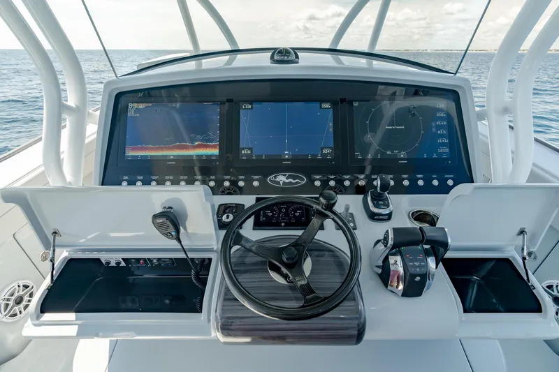 Slide: The Image of 2023 Valhalla Boatworks V-41 helm with advanced navigation displays and controls. - 9