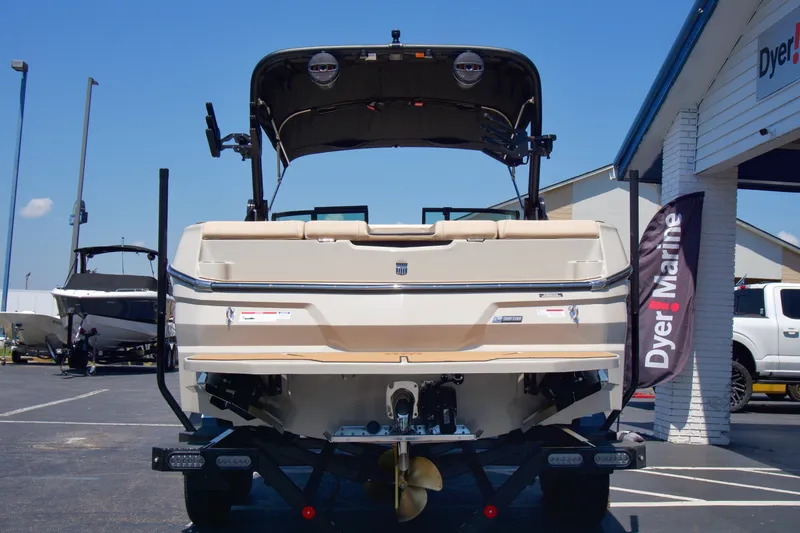Slide: The Image of 2025 MasterCraft NXT22 boat displayed at Dyer Marine dealership. - 6