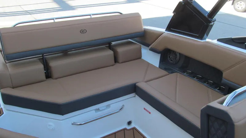 Slide: The Image of 2025 Cobalt R4 boat interior with tan leather seating and modern design. - 12