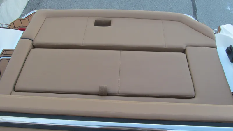 Slide: The Image of Cobalt R4 2025 boat with tan cushioned seating area. - 14