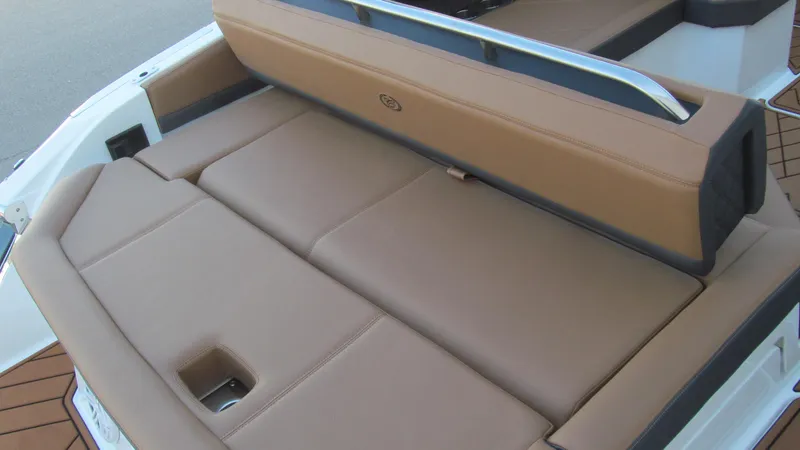 Slide: The Image of 2025 Cobalt R4 boat with tan leather seating and sleek design. - 16
