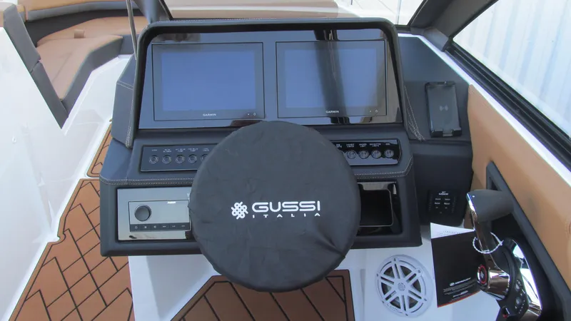 Slide: The Image of Cobalt R4 2025 boat dashboard with dual screens and Gussi Italia steering wheel. - 6