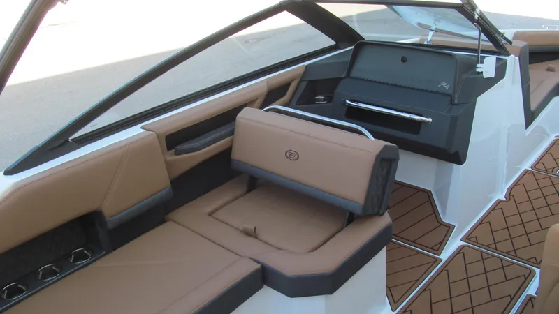 Slide: The Image of Luxurious interior of 2025 Cobalt R4 boat with tan leather seating and modern design. - 8