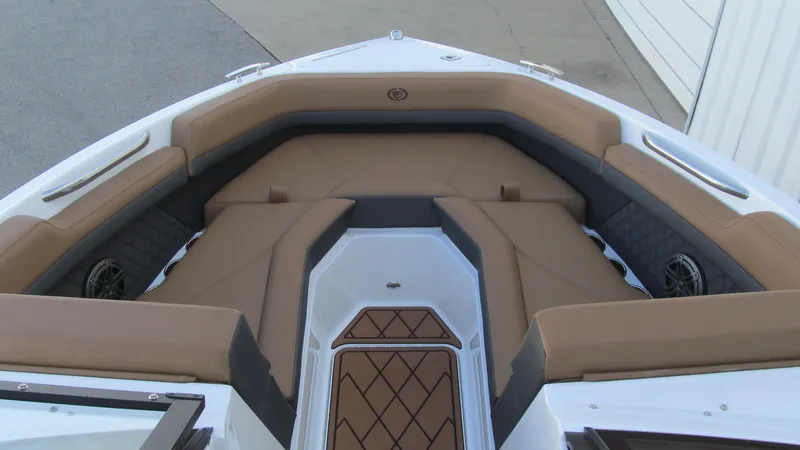 Slide: The Image of 2025 Cobalt R4 boat interior with tan seating and modern design. - 9