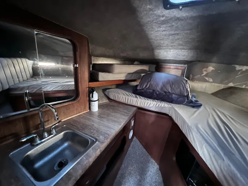 Slide: The Image of Interior cabin of 1985 Bayliner 3250 Conquest with sink and sleeping area. - 23