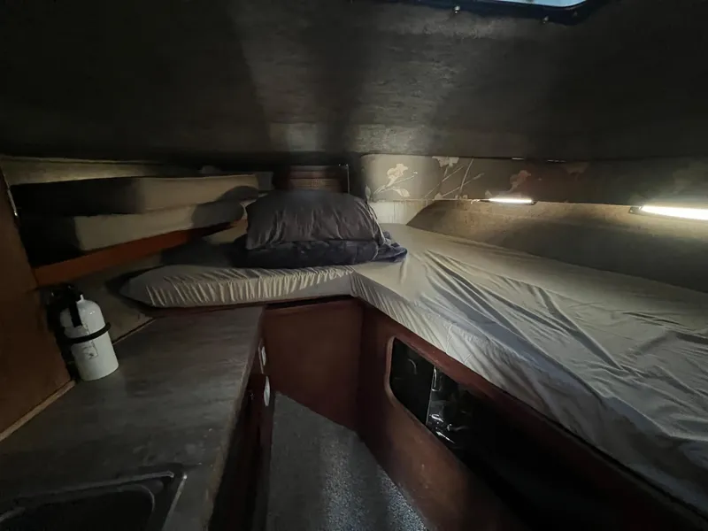 Slide: The Image of Interior cabin of 1985 Bayliner 3250 Conquest with beds and kitchenette. - 24