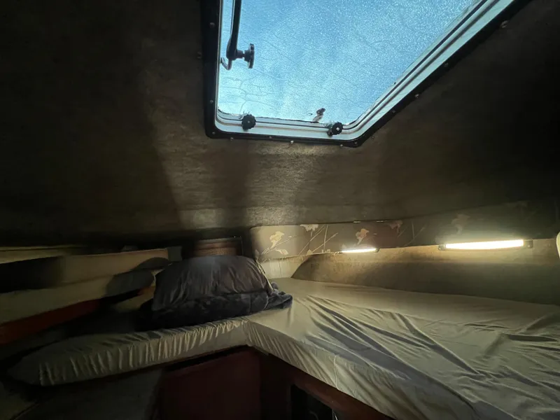 Slide: The Image of Interior cabin of 1985 Bayliner 3250 Conquest with bed and skylight. - 26