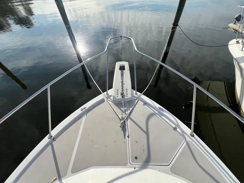 Slide: The Image of 1985 Bayliner 3250 Conquest bow view on calm water. - 28