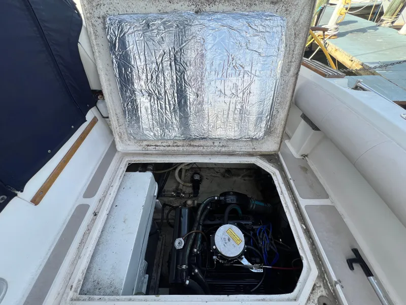 Slide: The Image of Engine compartment of 1985 Bayliner 3250 Conquest boat, showing engine and insulation. - 30