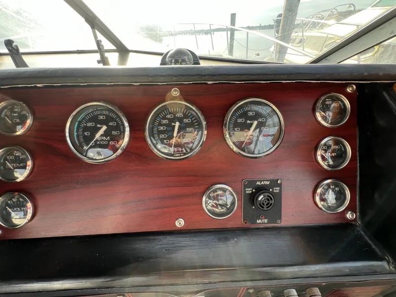 Slide: The Image of Dashboard of 1985 Bayliner 3250 Conquest boat with gauges and controls. - 8