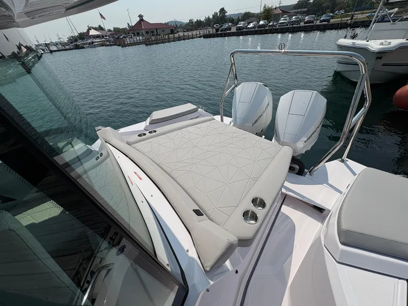 Slide: The Image of 2025 Axopar 29 XC Cross Cabin boat with cushioned deck and twin Mercury engines. - 20