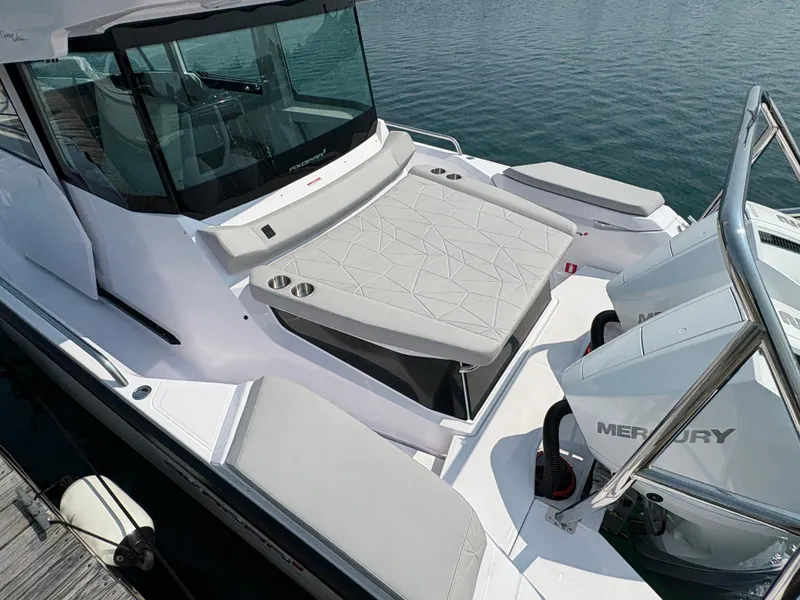 Slide: The Image of 2025 Axopar 29 XC Cross Cabin boat with sleek design and Mercury engines. - 7