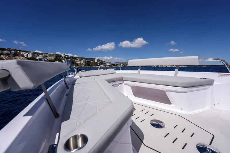 Slide: The Image of 2025 Axopar 29 Sun Top boat with spacious seating and ocean view. - 17