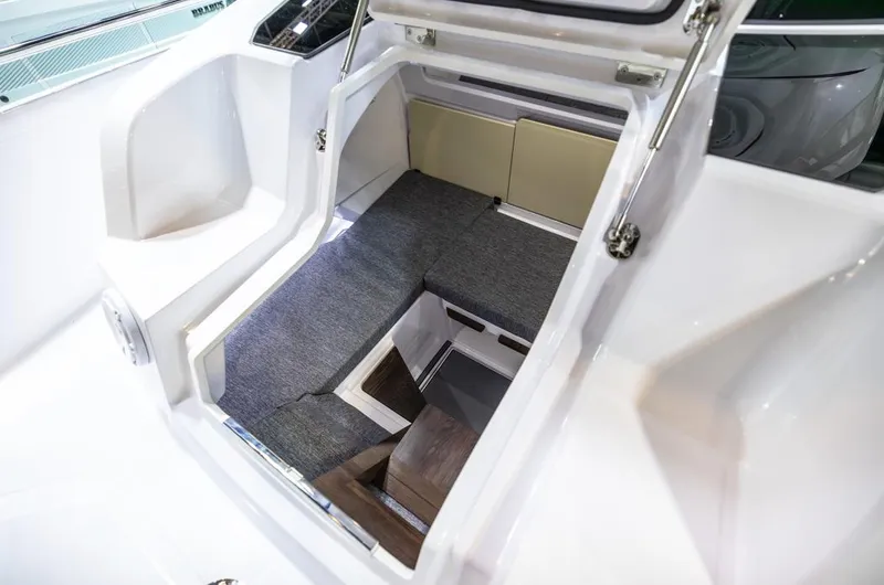 Slide: The Image of Interior cabin of 2025 Axopar 29 Sun Top boat with seating and storage. - 24