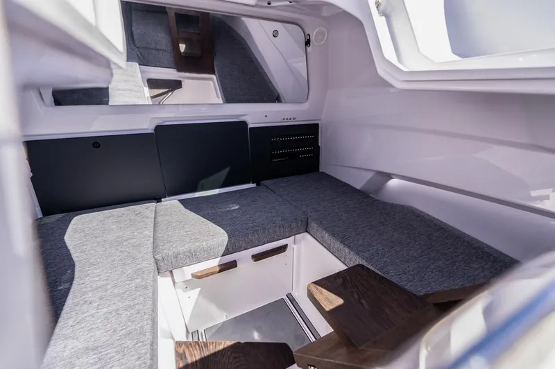 Slide: The Image of Interior cabin of 2025 Axopar 29 Sun Top with gray seating and modern design. - 25