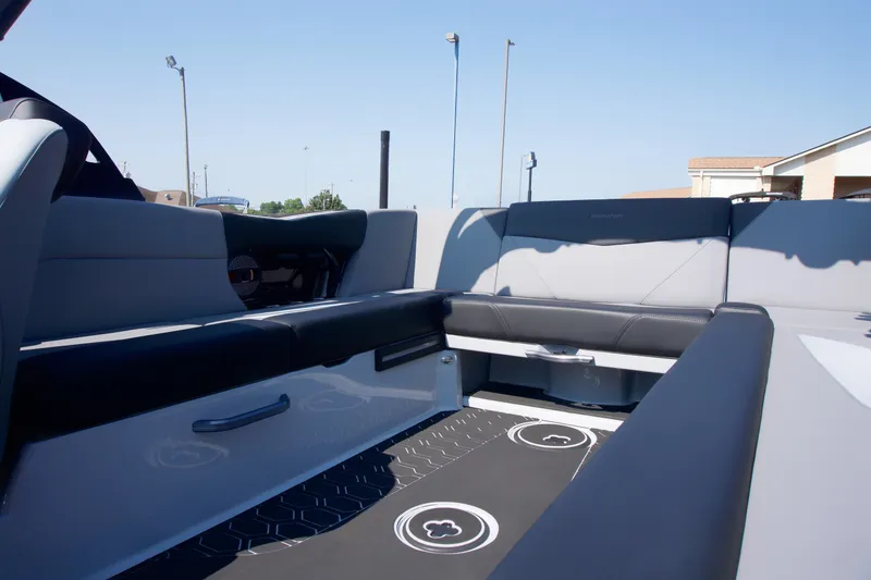 Slide: The Image of 2025 MasterCraft NXT24 boat interior with sleek seating and modern design. - 10