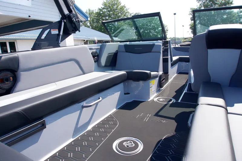 Slide: The Image of 2025 MasterCraft NXT24 boat interior with sleek seating and modern design. - 11