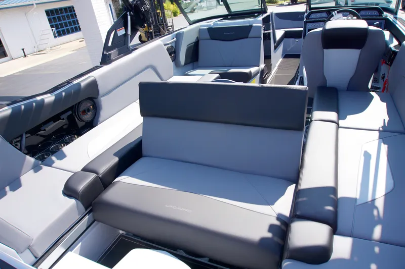 Slide: The Image of 2025 MasterCraft NXT24 boat interior with modern seating and sleek design. - 12