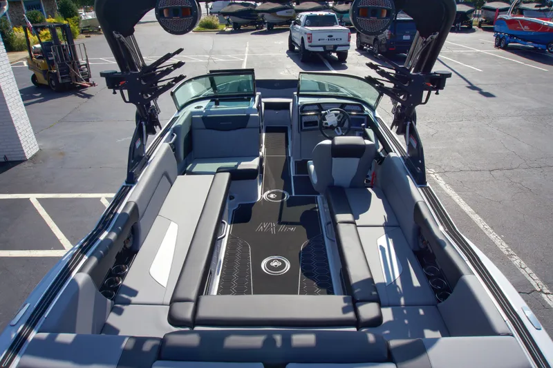 Slide: The Image of 2025 MasterCraft NXT24 boat interior with spacious seating and modern design. - 7