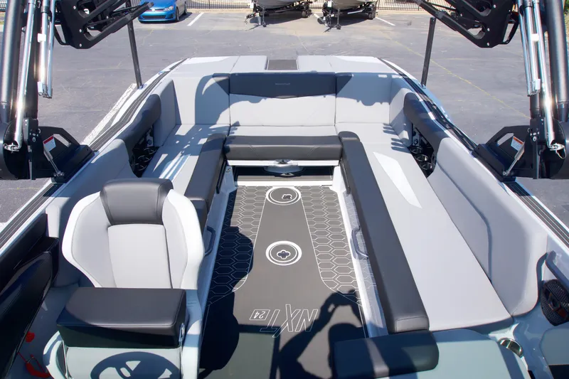 Slide: The Image of 2025 MasterCraft NXT24 boat interior with spacious seating and modern design. - 9
