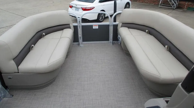 Slide: The Image of 2025 Sun Tracker PARTY BARGE® 16 DLX interior with beige seating and spacious layout. - 8