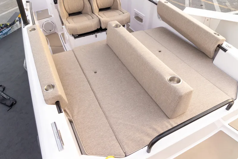 Slide: The Image of 2025 Axopar 25 Cross Top boat roof structure in an indoor showroom. - 17