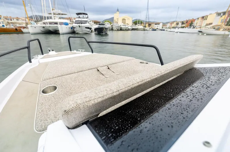 Slide: The Image of 2025 Axopar 25 Cross Top boat displayed at an indoor exhibition. - 19